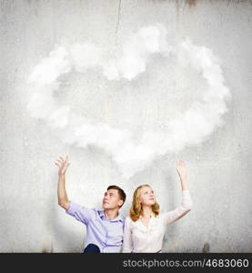 Young happy couple. Conceptual image of young couple sitting on floor