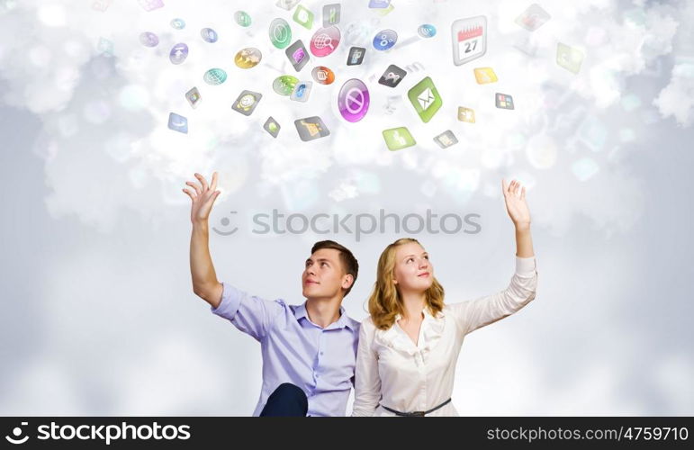 Young happy couple. Conceptual image of young couple sitting on floor