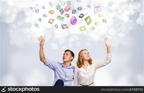 Young happy couple. Conceptual image of young couple sitting on floor