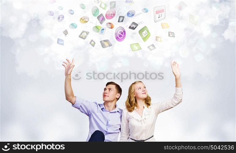 Young happy couple. Conceptual image of young couple sitting on floor