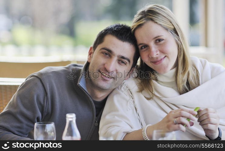 young happy couple have fun on coffee break at bright morning