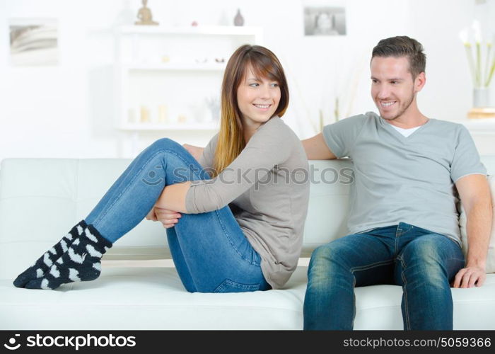 young happy couple on sofa