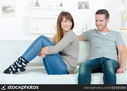 young happy couple on sofa