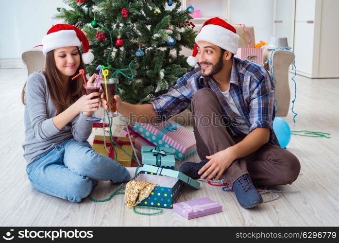 Young happy family celebrating christmas