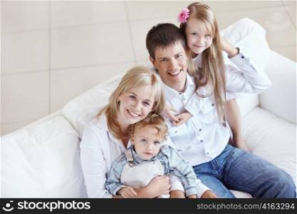 Young happy family with two children