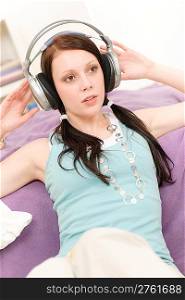Young happy girl relax listen to music wear headphones
