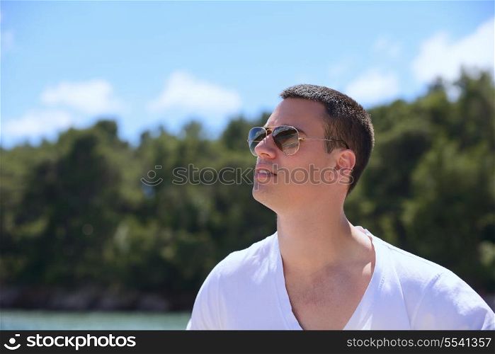 young happy man have fun on luxury boat yacht
