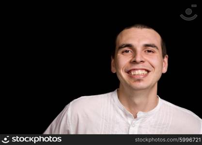 young happy man portrait, on a black background
