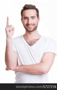 Young happy man with good idea sign in casuals isolated on white background.