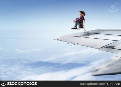 Young happy student woman or businesswoman sitting on a wheel chair.