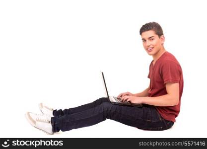 Young happy student working with a laptop computer, isolated