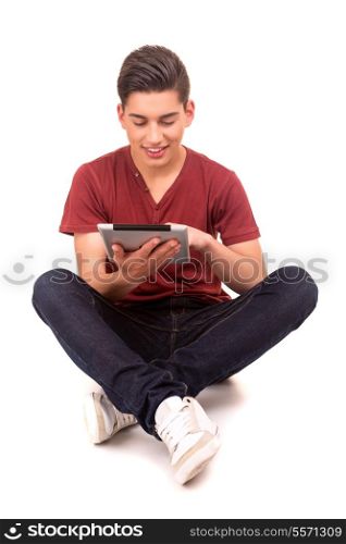 Young happy student working with a new digital tablet computer