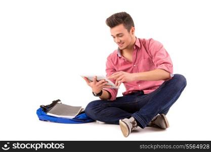 Young happy student working with a new digital tablet computer, isolated