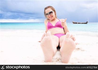 Young happy woman at the beach