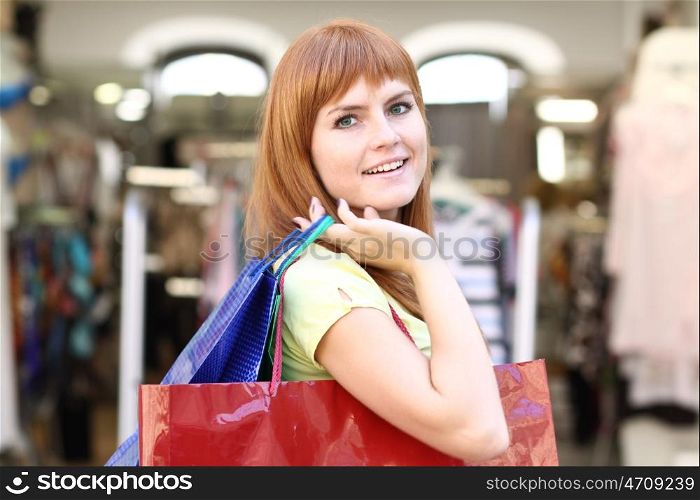 Young happy woman in shop