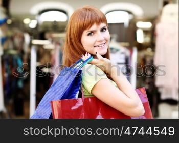 Young happy woman in shop