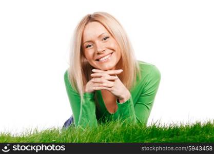 Young happy woman lying on spring grass, isolated on white background