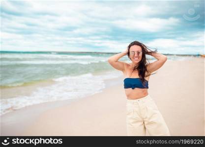 Young happy woman on beach vacation. Young happy woman on the beach