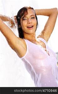 Young happy woman wet in the rain
