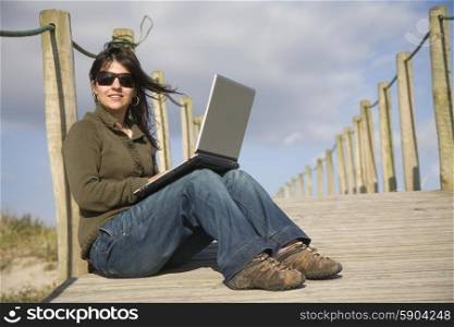 young happy woman working with her laptop