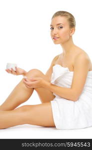 Young healthy girl applying body cream isolated