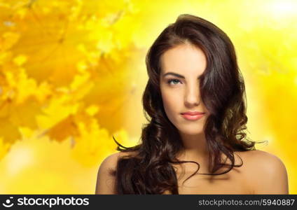 Young healthy girl on autumnal background