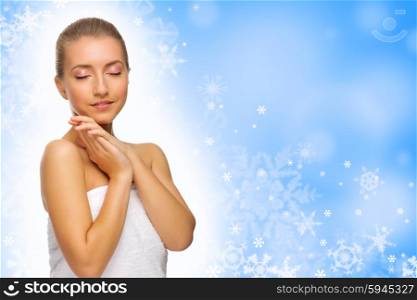 Young healthy girl on blue winter background