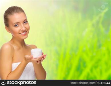 Young healthy girl with body cream jar isolated