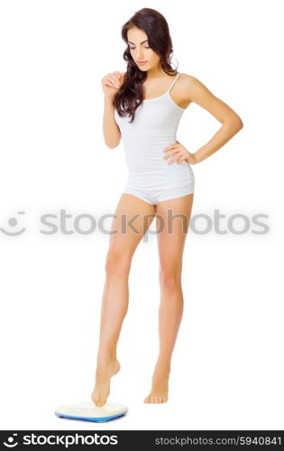 Young healthy girl with home scales isolated