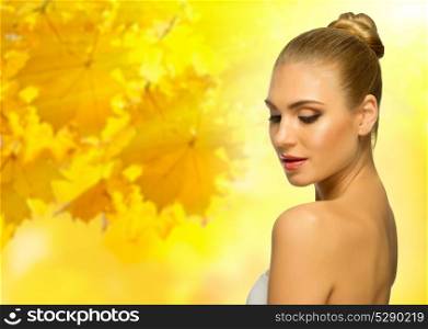 Young healthy woman at autumnal background