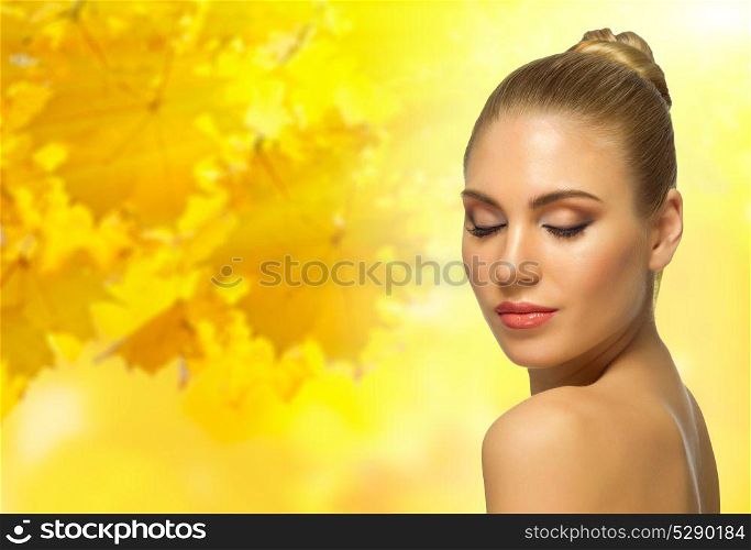 Young healthy woman on autumnal background