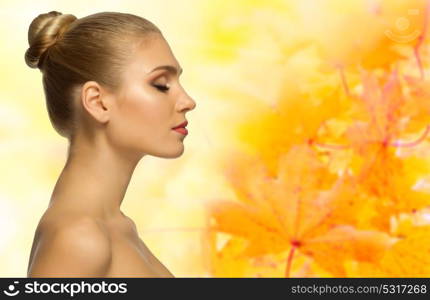 Young healthy woman on autumnal background