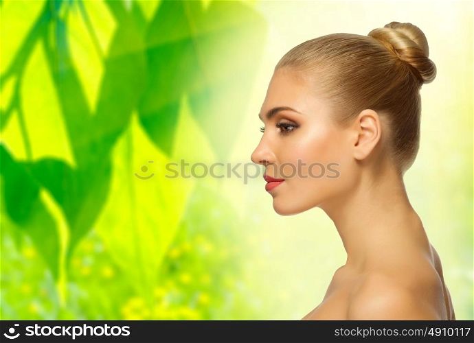 Young healthy woman on floral spring background