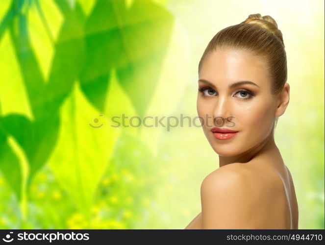 Young healthy woman on floral spring background