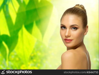 Young healthy woman on floral spring background