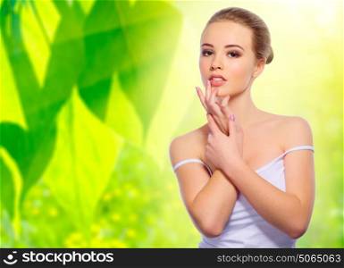 Young healthy woman on spring background