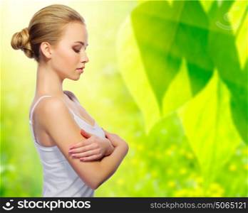 Young healthy woman on spring background