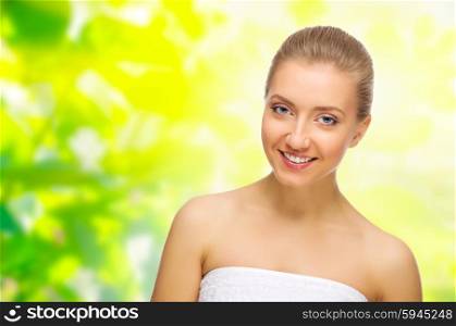 Young healthy woman on spring floral background