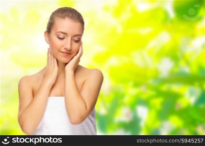 Young healthy woman on spring floral background