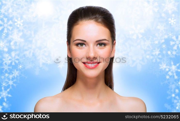 Young healthy woman on winter background