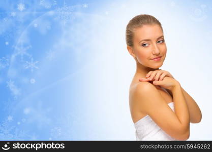 Young healthy woman on winter background