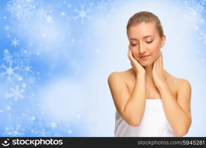 Young healthy woman on winter background