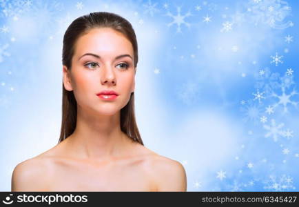 Young healthy woman on winter background