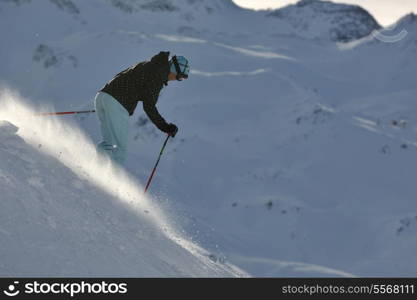 young healthy woman skiing on fresh snow at winter season in france alps