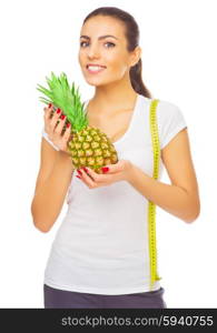 Young healthy woman with pineapple and measurement tape isolated