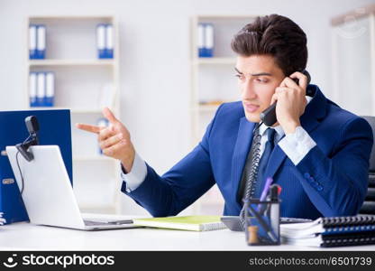 Young help desk operator working in office