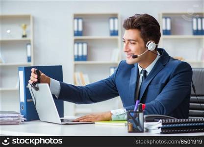 Young help desk operator working in office