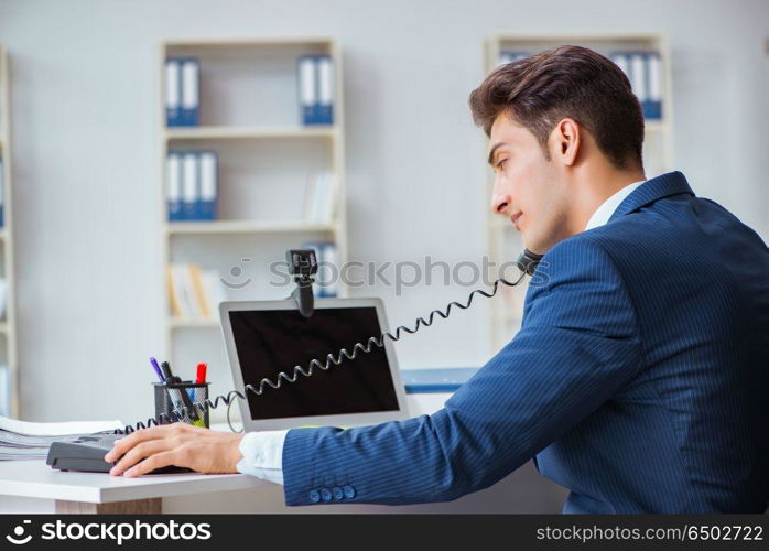 Young help desk operator working in office