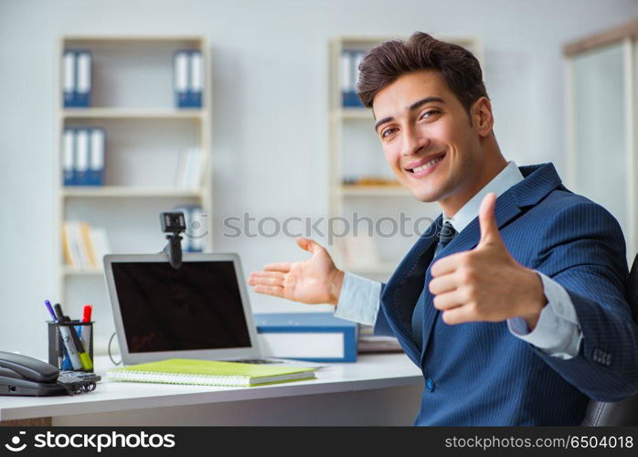 Young help desk operator working in office