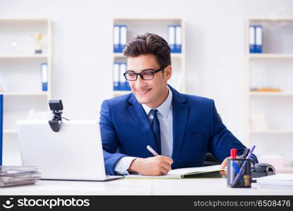 Young help desk operator working in office